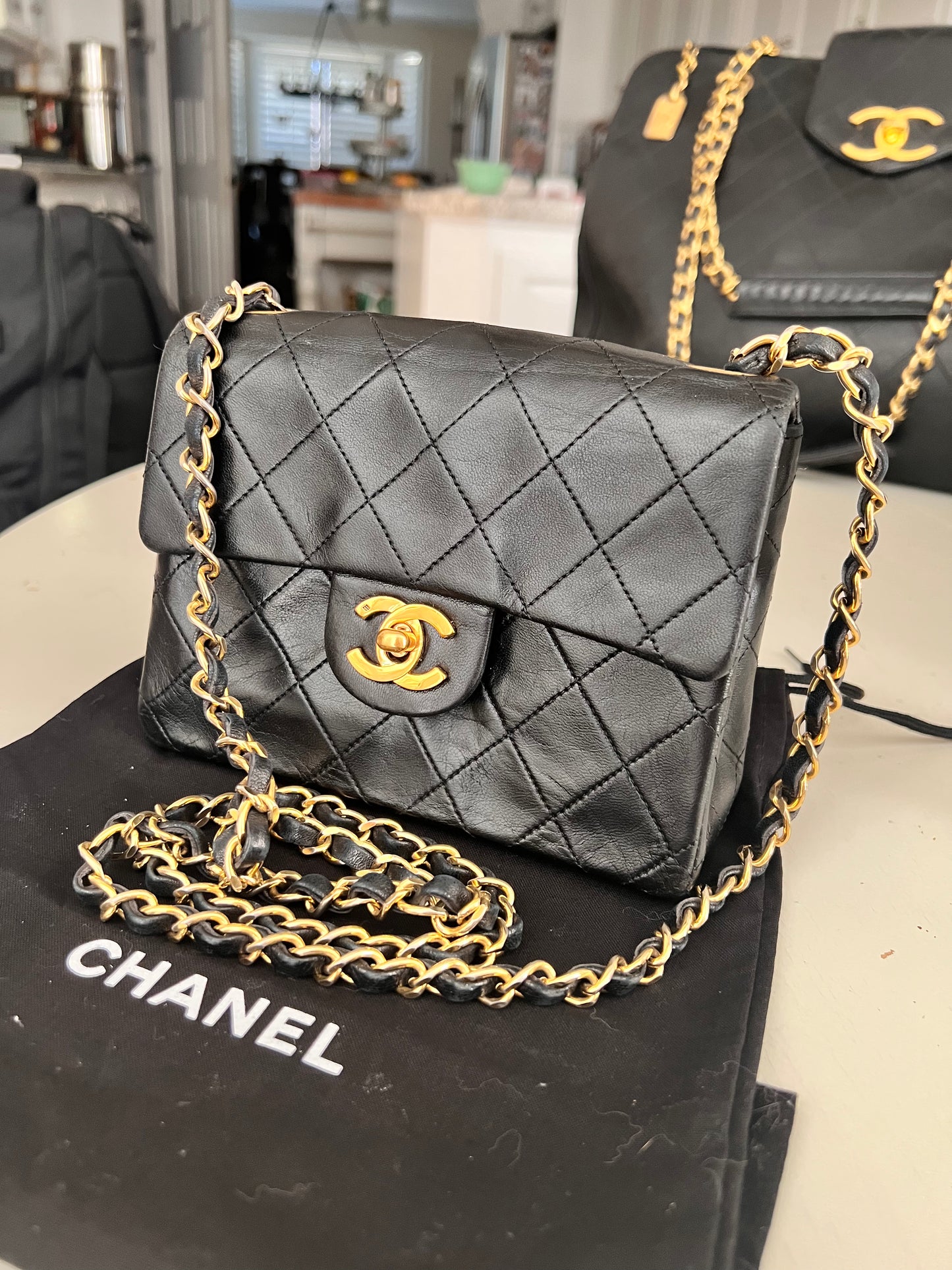 Chanel vintage mini square black lambskin 24k ghw