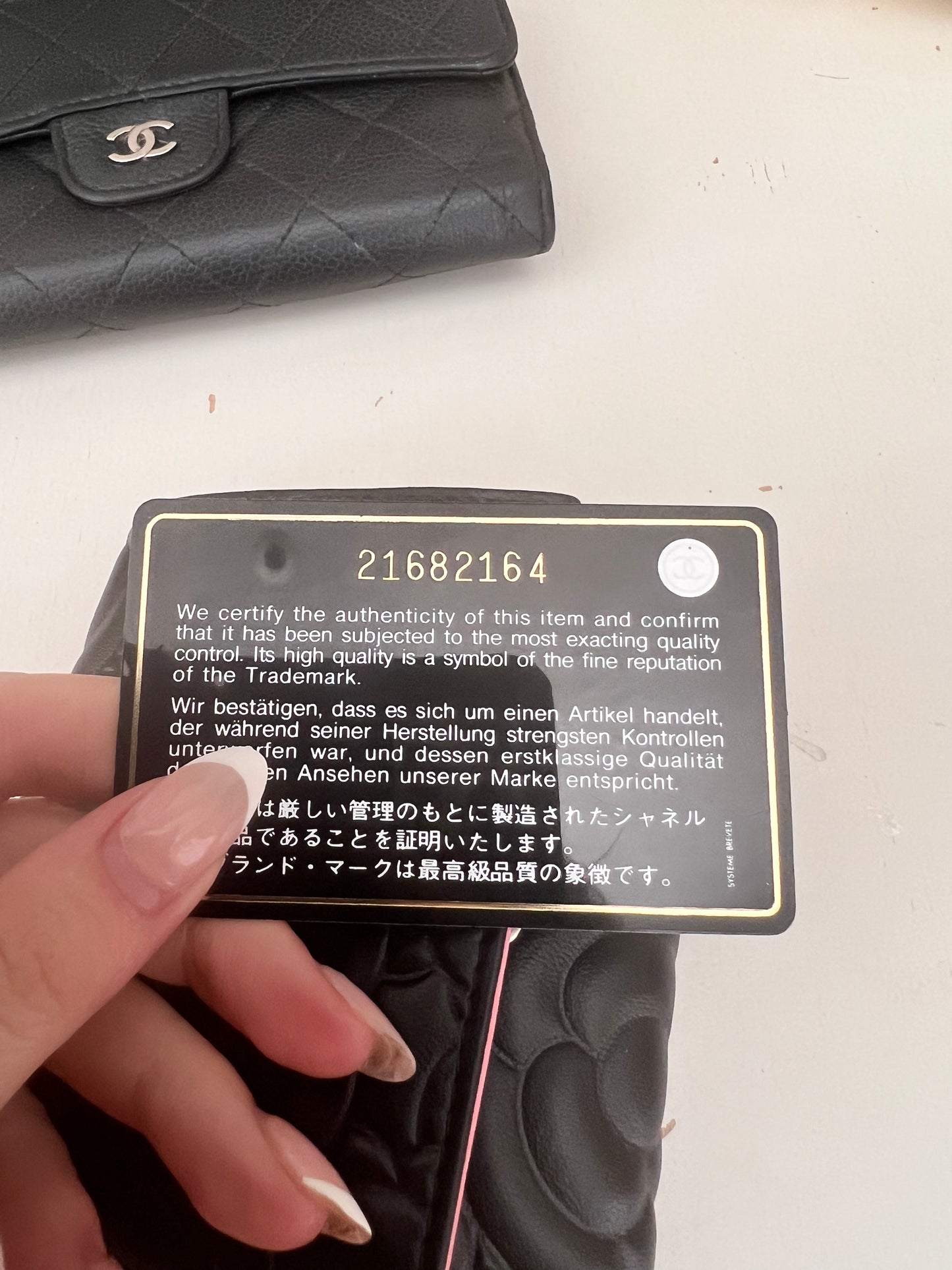 Chanel Camellia black leather compact trifold wallet