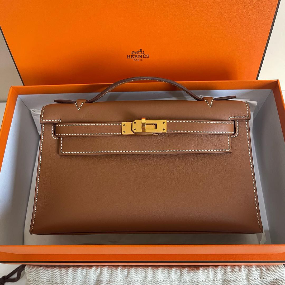 Hermes Kelly pochette gold on gold GHW swift stamp U