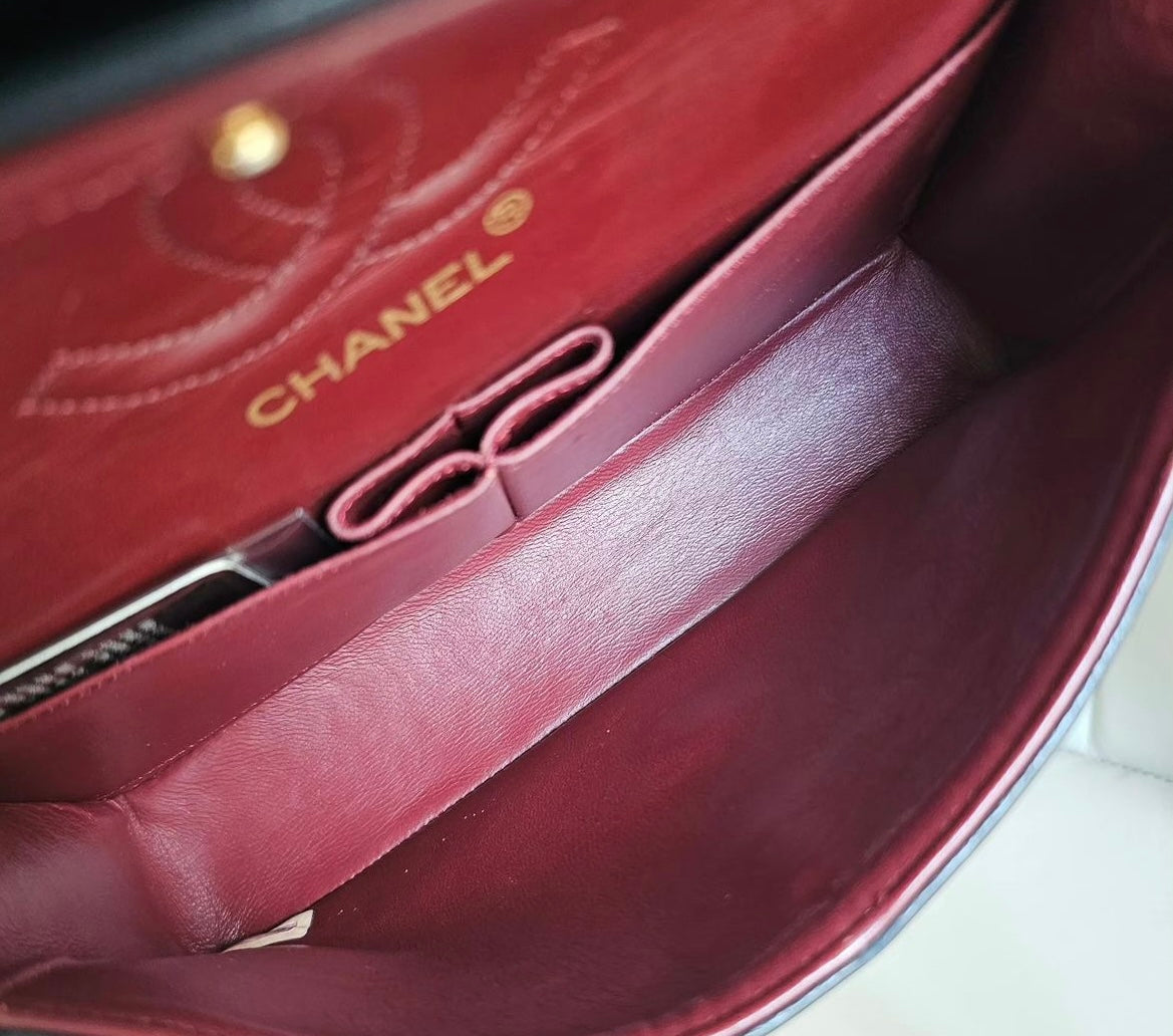 Chanel vintage small black lambskin classic flap handbag