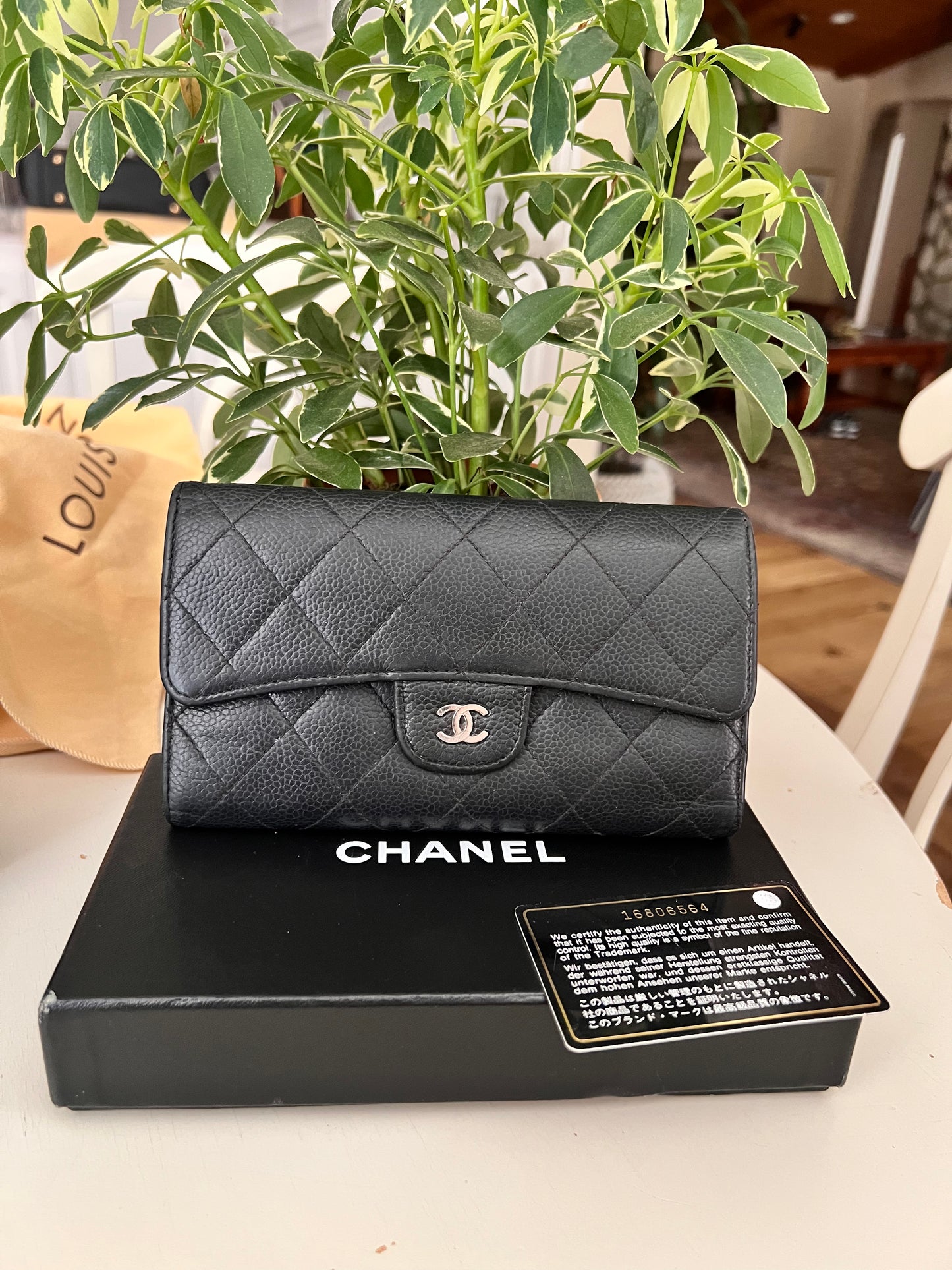 Chanel black caviar trifold flap long wallet