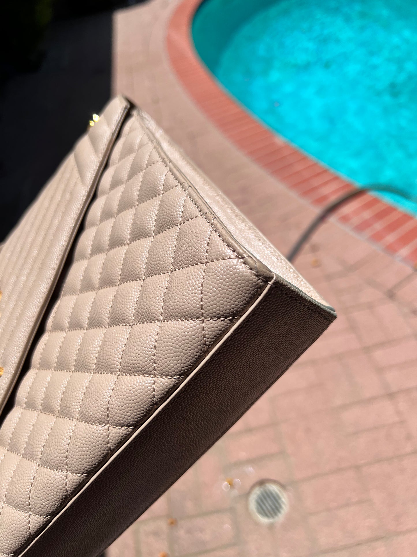 Yves Saint Laurent Grain De Poudre Textured Mixed Matelasse Large Envelope in Triquilt dark beige bag
